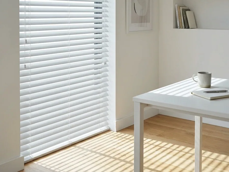 Aluminium venetian blinds tilted open over a kitchen window in a Birdhaven, Johannesburg home