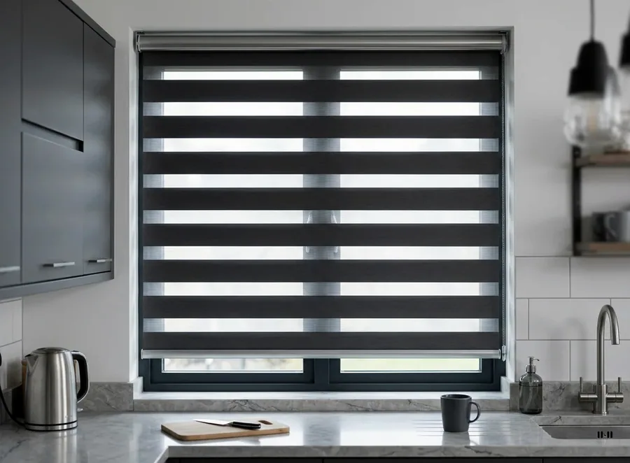 Day/night zebra blind with alternating sheer and solid bands covering a Birdhaven window beside a garden view